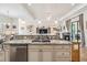 Open-concept kitchen with granite countertops, stainless steel appliances, and a spacious island at 1275 Blue Lake Cir, Punta Gorda, FL 33983