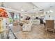 Open concept living room with high ceilings and neutral-toned furniture at 1275 Blue Lake Cir, Punta Gorda, FL 33983
