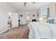 Spacious main bedroom with an ensuite bathroom and a view of the living room at 1275 Blue Lake Cir, Punta Gorda, FL 33983