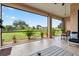 Screened-in patio with a view of the well-manicured backyard at 1275 Blue Lake Cir, Punta Gorda, FL 33983