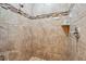 Updated walk-in shower features neutral-toned tile and decorative accent border at 1275 Blue Lake Cir, Punta Gorda, FL 33983