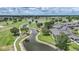 An aerial view of a condo building in a golf community near a pond at 1375 Saxony Cir # 124, Punta Gorda, FL 33983