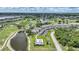 An aerial view of a condo in a golf community with a pool and pond at 1375 Saxony Cir # 124, Punta Gorda, FL 33983