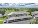 Beautiful aerial view of condos overlooking a golf course with covered parking and lush landscaping at 1375 Saxony Cir # 124, Punta Gorda, FL 33983