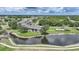 A condo building on the water with a pool and grassy area at 1375 Saxony Cir # 124, Punta Gorda, FL 33983