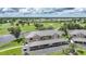 Beautiful aerial view of condos overlooking a golf course with covered parking and lush landscaping at 1375 Saxony Cir # 124, Punta Gorda, FL 33983