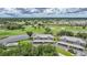 An aerial view of a condo building in a golf community with covered parking and a community pool at 1375 Saxony Cir # 124, Punta Gorda, FL 33983
