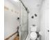 Toilet and shower room featuring a walk-in shower with tiled walls and a glass enclosure at 1375 Saxony Cir # 124, Punta Gorda, FL 33983
