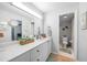 Bathroom featuring a large mirror, modern vanity, and doorway to the toilet and shower room at 1375 Saxony Cir # 124, Punta Gorda, FL 33983