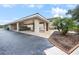 Carport provides covered parking and complements the community's manicured landscaping at 1375 Saxony Cir # 124, Punta Gorda, FL 33983