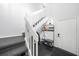 Inviting entryway with modern decor, featuring a bench with storage, coat rack, and stylish lighting at 1375 Saxony Cir # 124, Punta Gorda, FL 33983