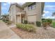 Charming condo exterior with well-maintained landscaping, stone details, and a cozy front porch at 1375 Saxony Cir # 124, Punta Gorda, FL 33983