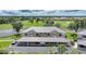 An aerial view of a condo building in a golf community with covered parking at 1375 Saxony Cir # 124, Punta Gorda, FL 33983