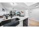 Open concept kitchen with a breakfast bar overlooking the living area and views of the outdoor space at 1375 Saxony Cir # 124, Punta Gorda, FL 33983