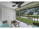 Enjoy the view from this screened lanai with comfortable seating, overlooking a golf course and waterway at 1375 Saxony Cir # 124, Punta Gorda, FL 33983