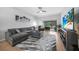 Spacious living room with sliding glass doors to lanai, comfortable seating, and neutral decor at 1375 Saxony Cir # 124, Punta Gorda, FL 33983