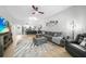 Open-concept living room boasts modern furnishings and a seamless flow into the kitchen area at 1375 Saxony Cir # 124, Punta Gorda, FL 33983