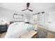 Comfortable main bedroom with a sliding barn door to ensuite bathroom, ceiling fan, and neutral colors at 1375 Saxony Cir # 124, Punta Gorda, FL 33983