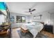 Inviting main bedroom featuring a serene golf course view, ceiling fan, and comfortable furniture at 1375 Saxony Cir # 124, Punta Gorda, FL 33983