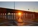 Sunrise over the water shines through a bridge next to a compass painted on the cement at 1375 Saxony Cir # 124, Punta Gorda, FL 33983