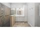 Modern bathroom features tiled walk-in shower and vanity with white cabinets at 14311 Reserve Ct, Port Charlotte, FL 33953