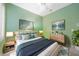 Comfortable primary bedroom featuring a king-sized bed and matching nightstands at 14311 Reserve Ct, Port Charlotte, FL 33953
