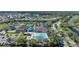 Aerial view of a community featuring a pool, tennis courts, clubhouse, and RV parking at 14311 Reserve Ct, Port Charlotte, FL 33953