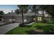 Charming home featuring a well-manicured lawn and a three car garage at 14311 Reserve Ct, Port Charlotte, FL 33953