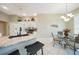 Open kitchen with white cabinets, granite countertops, and a cozy breakfast nook at 14311 Reserve Ct, Port Charlotte, FL 33953
