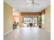 Bright living area showcasing seamless indoor/outdoor flow to screened lanai and pool at 14311 Reserve Ct, Port Charlotte, FL 33953