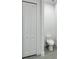 Bathroom with toilet and bifold door at 14520 Edna Cir, Port Charlotte, FL 33981