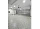 Spacious three car garage featuring epoxy floors and automatic door openers, providing ample parking and storage at 14520 Edna Cir, Port Charlotte, FL 33981