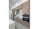 Modern kitchen boasts stainless steel appliances and sleek cabinetry at 14520 Edna Cir, Port Charlotte, FL 33981