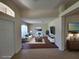 Staged living room featuring contemporary furniture and decor with tile floors at 15117 Lyneburg Ave, Port Charlotte, FL 33981