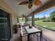 Relaxing screened patio with dining and seating area overlooking the yard at 15117 Lyneburg Ave, Port Charlotte, FL 33981