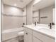 Bathroom featuring a double sink vanity, tiled shower and tub at 16403 Perdida Ct, Punta Gorda, FL 33955