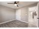 Bedroom featuring gray walls, closet, wood-look flooring and entry view to kitchen at 16403 Perdida Ct, Punta Gorda, FL 33955