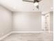 Neutral bedroom with gray wood floors and a ceiling fan at 16403 Perdida Ct, Punta Gorda, FL 33955