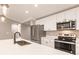 Modern kitchen featuring stainless steel appliances, quartz countertops and sleek cabinetry at 16403 Perdida Ct, Punta Gorda, FL 33955