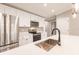 Modern kitchen with stainless steel appliances and a large island with seating at 16403 Perdida Ct, Punta Gorda, FL 33955