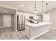 Modern kitchen showcasing a large island, stainless steel appliances, and ample cabinet space at 16403 Perdida Ct, Punta Gorda, FL 33955