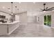 Modern open-concept kitchen with quartz countertops, stainless appliances, and modern fixtures at 16403 Perdida Ct, Punta Gorda, FL 33955