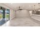 Expansive open floor plan with kitchen, dining, and living area filled with natural light at 16403 Perdida Ct, Punta Gorda, FL 33955