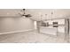 Bright, open-concept living room and kitchen with island, modern appliances, and sleek flooring at 16403 Perdida Ct, Punta Gorda, FL 33955