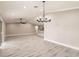 Spacious open-concept living room with hardwood flooring and recessed lighting at 16403 Perdida Ct, Punta Gorda, FL 33955