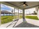 Screened patio with textured concrete flooring and a ceiling fan at 16403 Perdida Ct, Punta Gorda, FL 33955