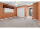 Comfortable bedroom features plush carpeting, a ceiling fan, closet and a window bringing in plenty of natural light at 17125 Canary Ln, Port Charlotte, FL 33948