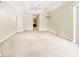 Large bedroom with neutral carpeting, ceiling fan and ensuite bathroom at 17125 Canary Ln, Port Charlotte, FL 33948