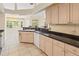Kitchen boasting granite countertops, updated appliances, and light wood cabinetry at 17125 Canary Ln, Port Charlotte, FL 33948