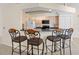 Kitchen with black countertops and barstool seating overlooking the living areas at 17125 Canary Ln, Port Charlotte, FL 33948
